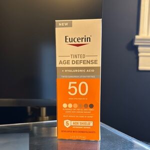 Tinted Age Defense SPF 50 - Orange & Gray